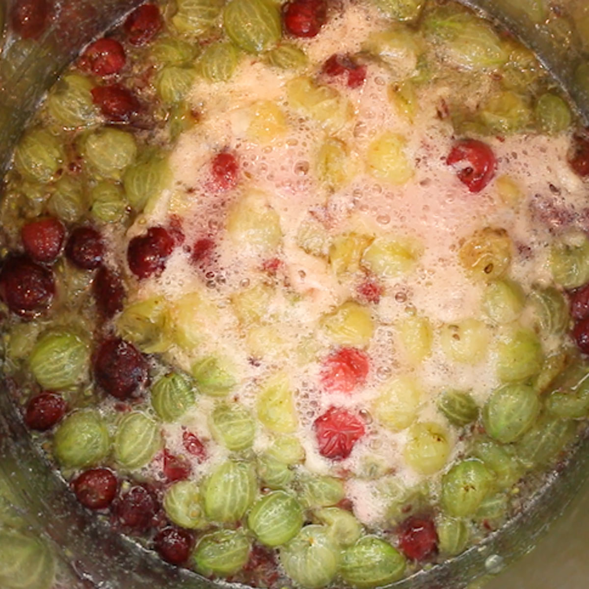 bringing gooseberries to a rolling boil with sugar