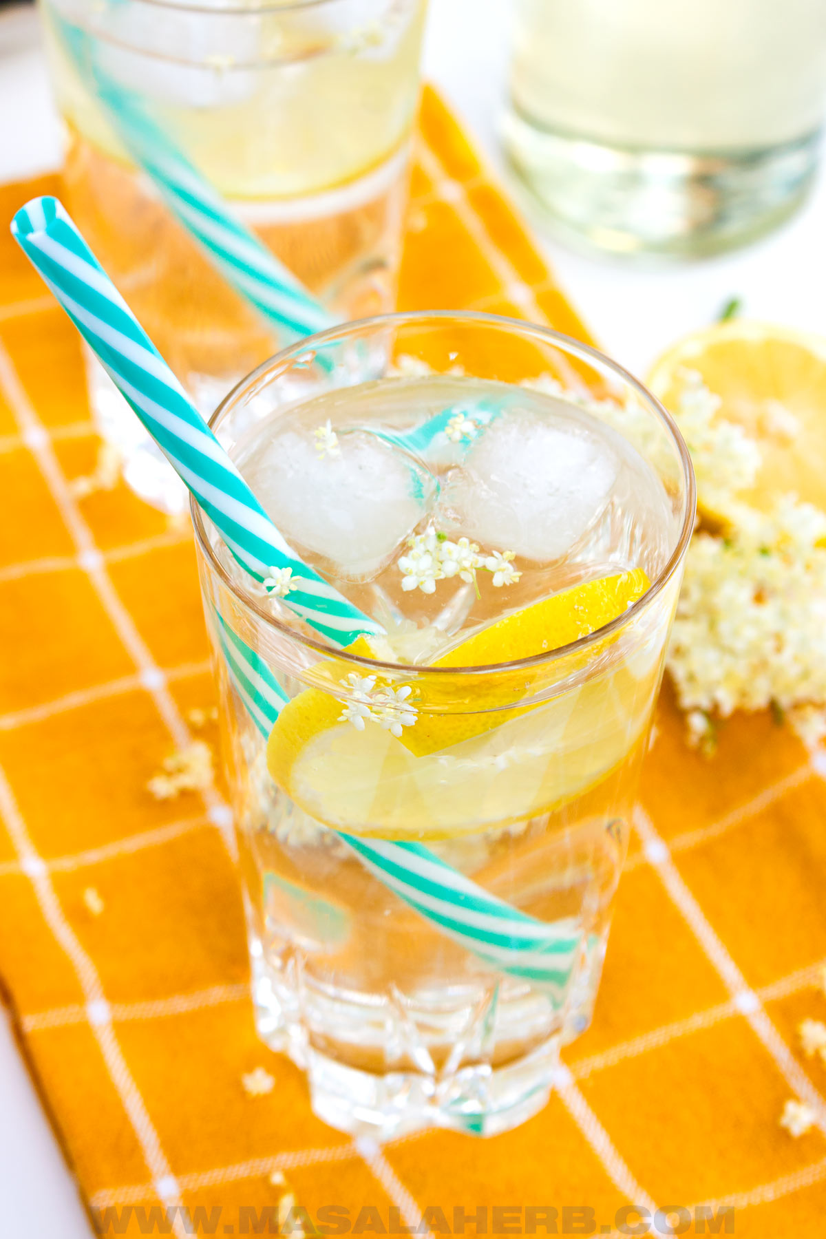 glass of refreshing lemon elderflower syrup water