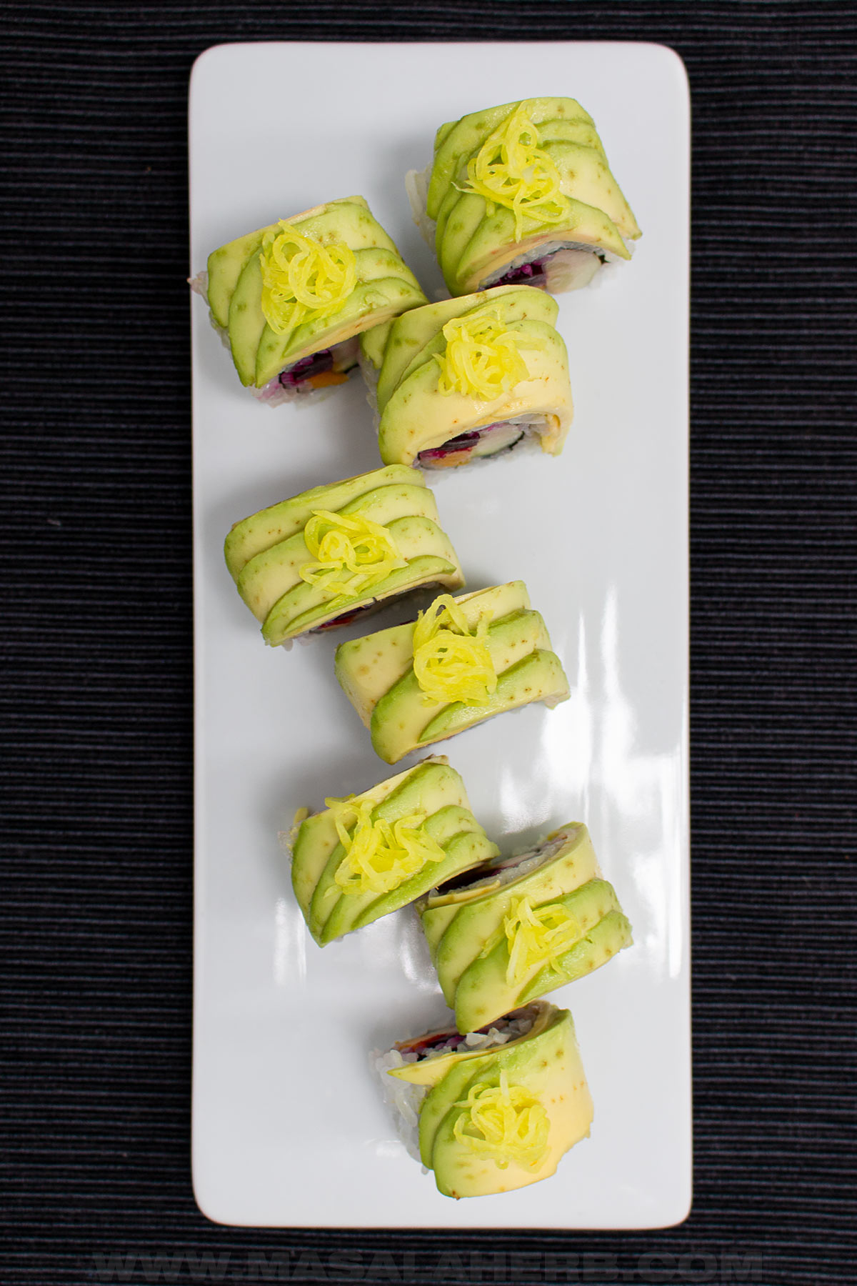 mango sushi wiht vegetables top down view