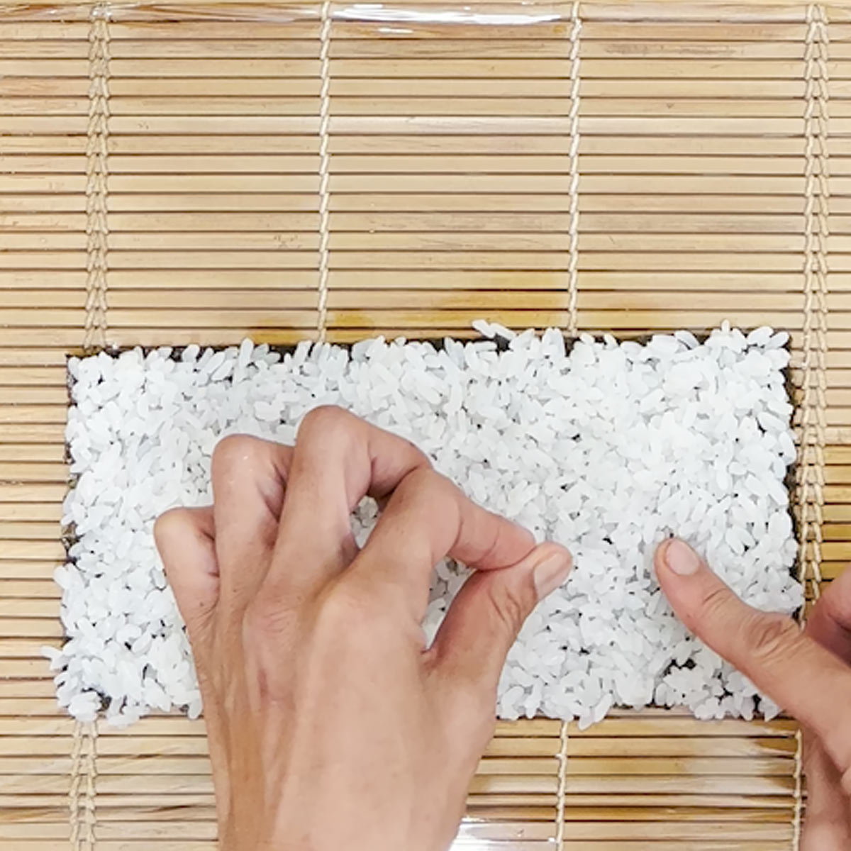 stick rice on nori for outer uramaki layer