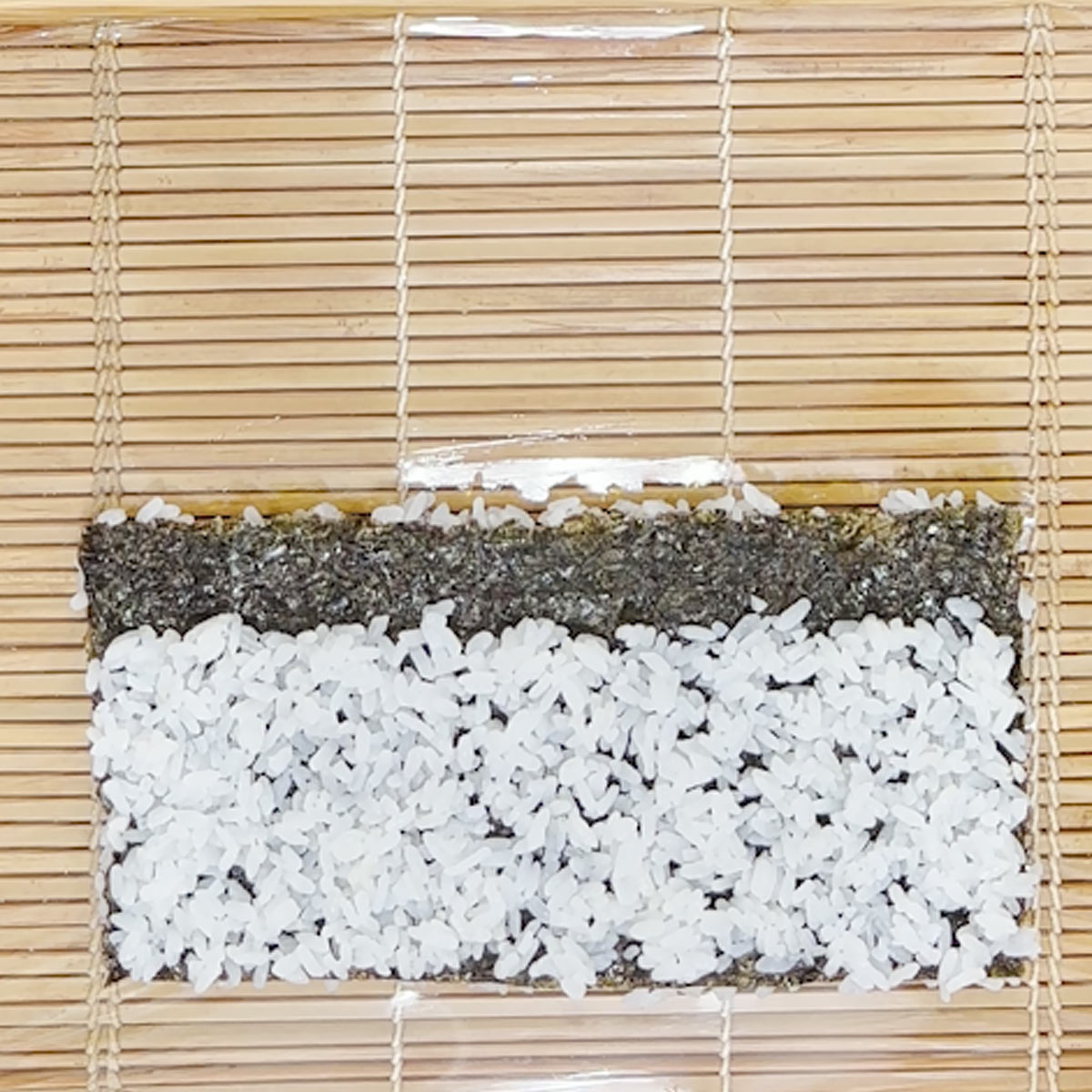 stick rice on nori for filling