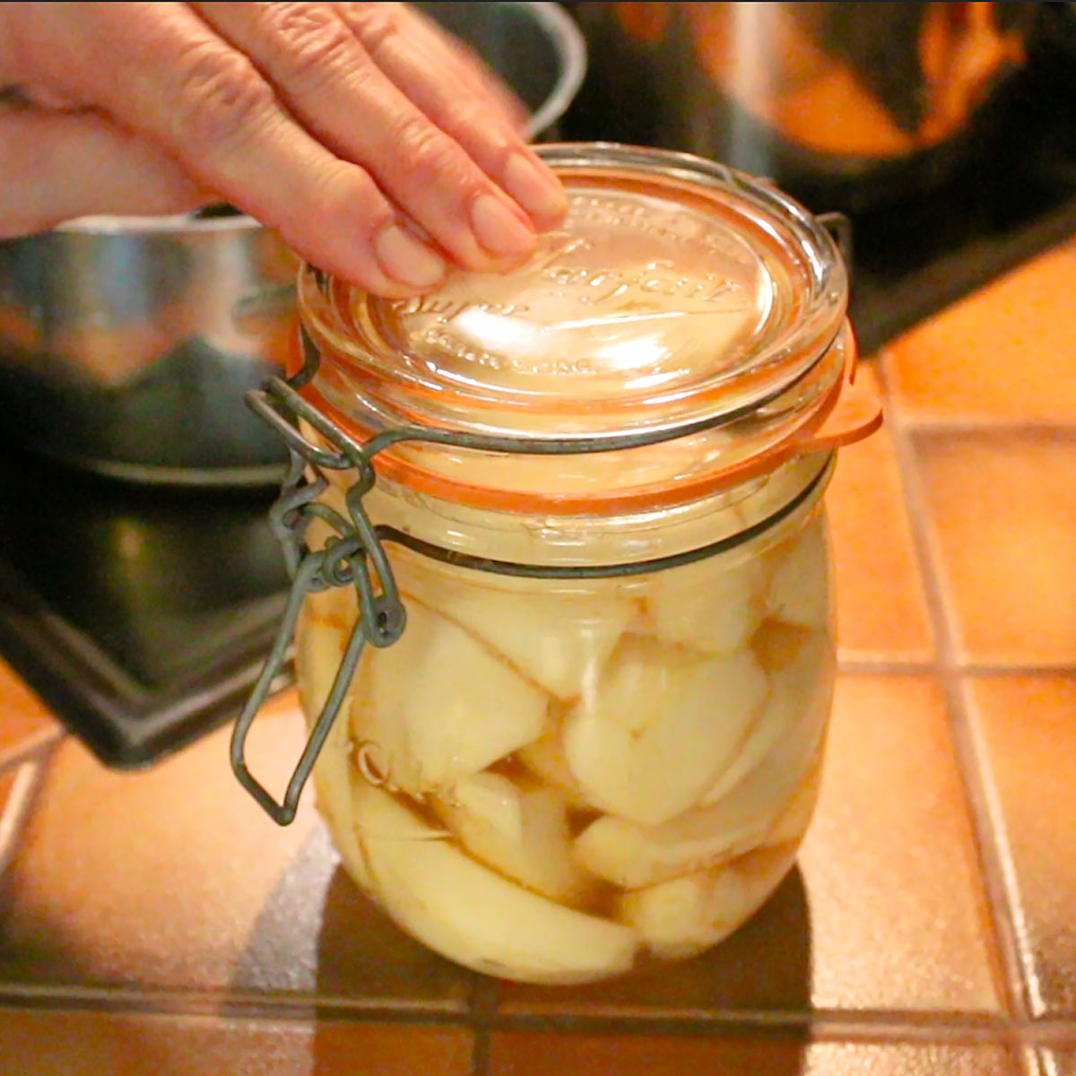 close jars with pear in it