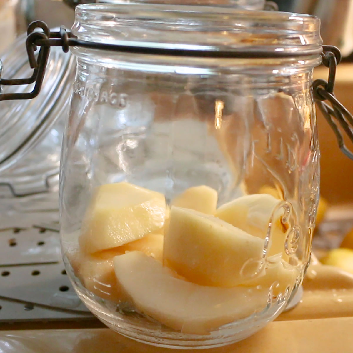 place clean and quartered pears into jars