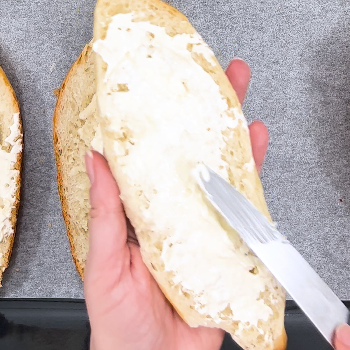spread cream cheese over french bread