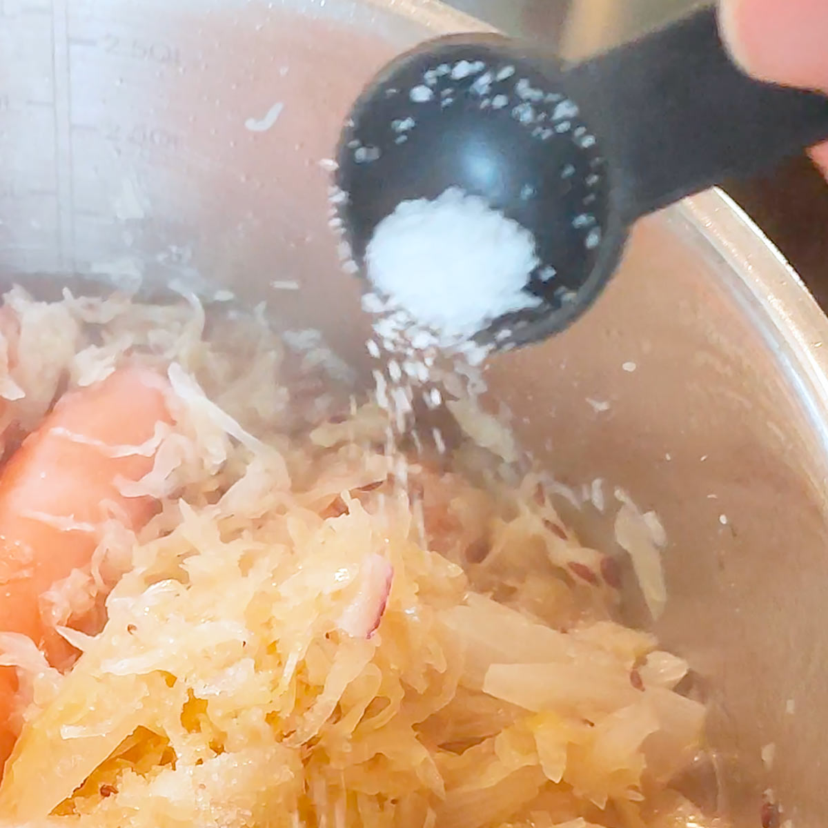 Add salt to the sauerkraut