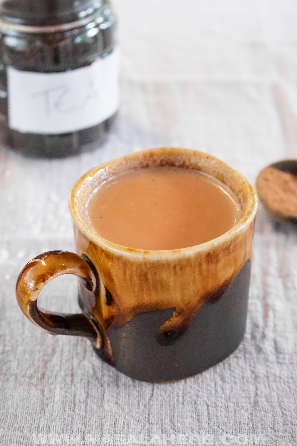 milk with tea leaves pumpkin pie spice to make hot chai