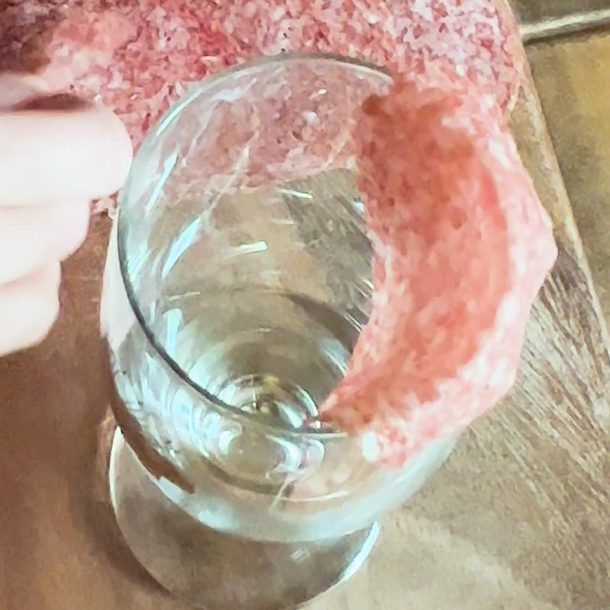 place first slice of salami over the glass