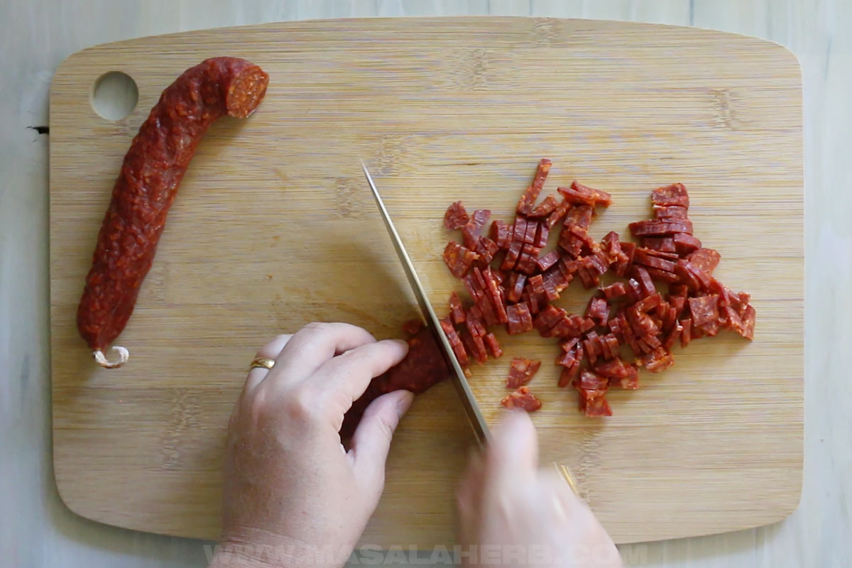 slicing Spanish chorizo sausage