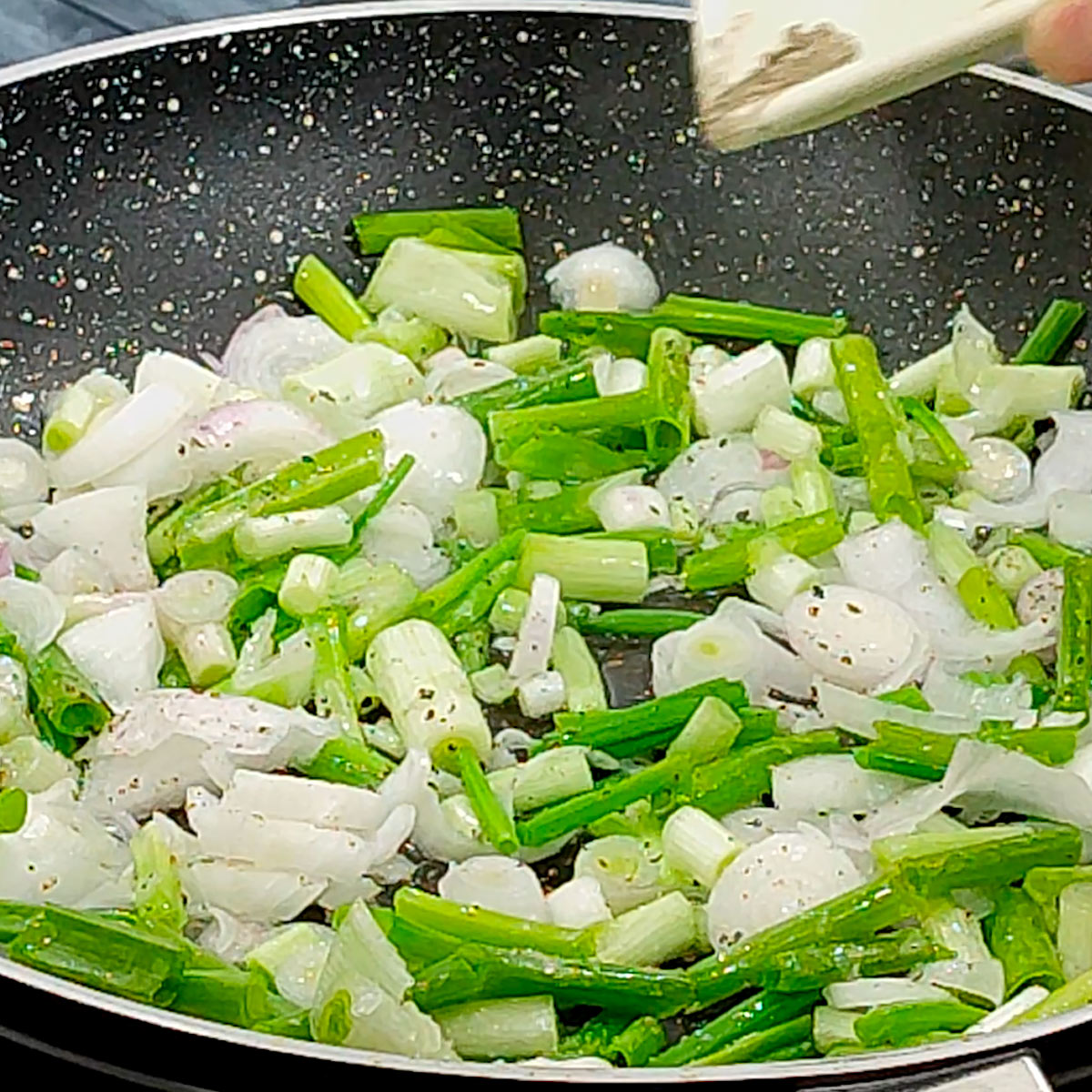 season spring onions with salt and pepper