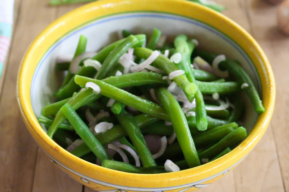 green beans and shallots in a serving bowl