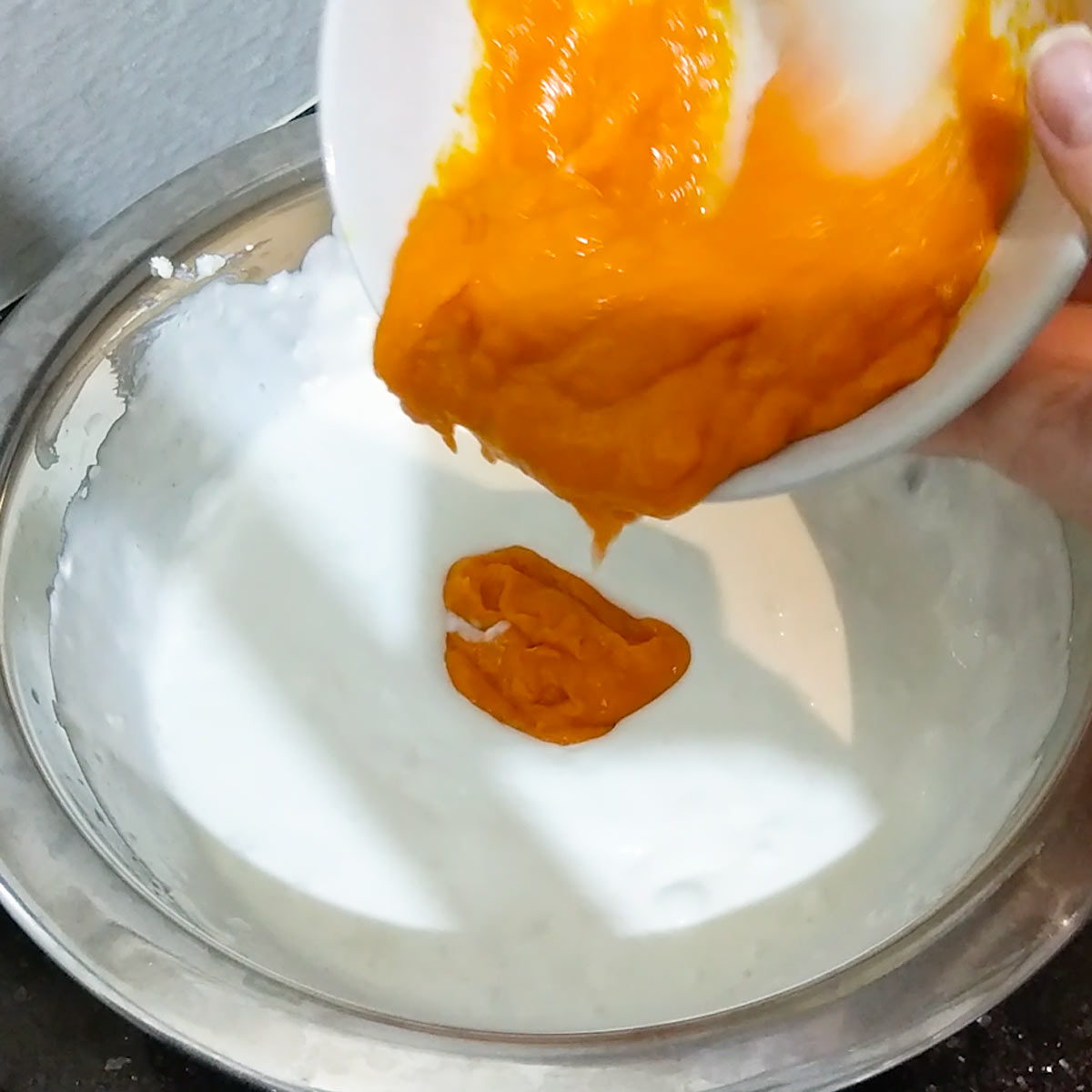 stir mango purée, sugar, and cream cheese into whipped cream