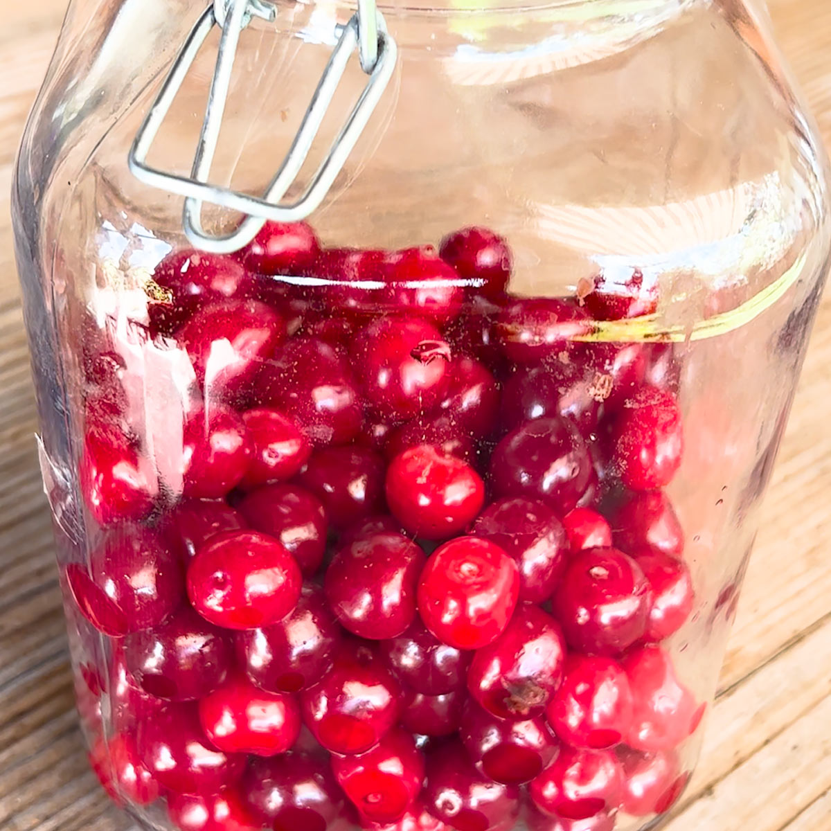 place cherries into a jar