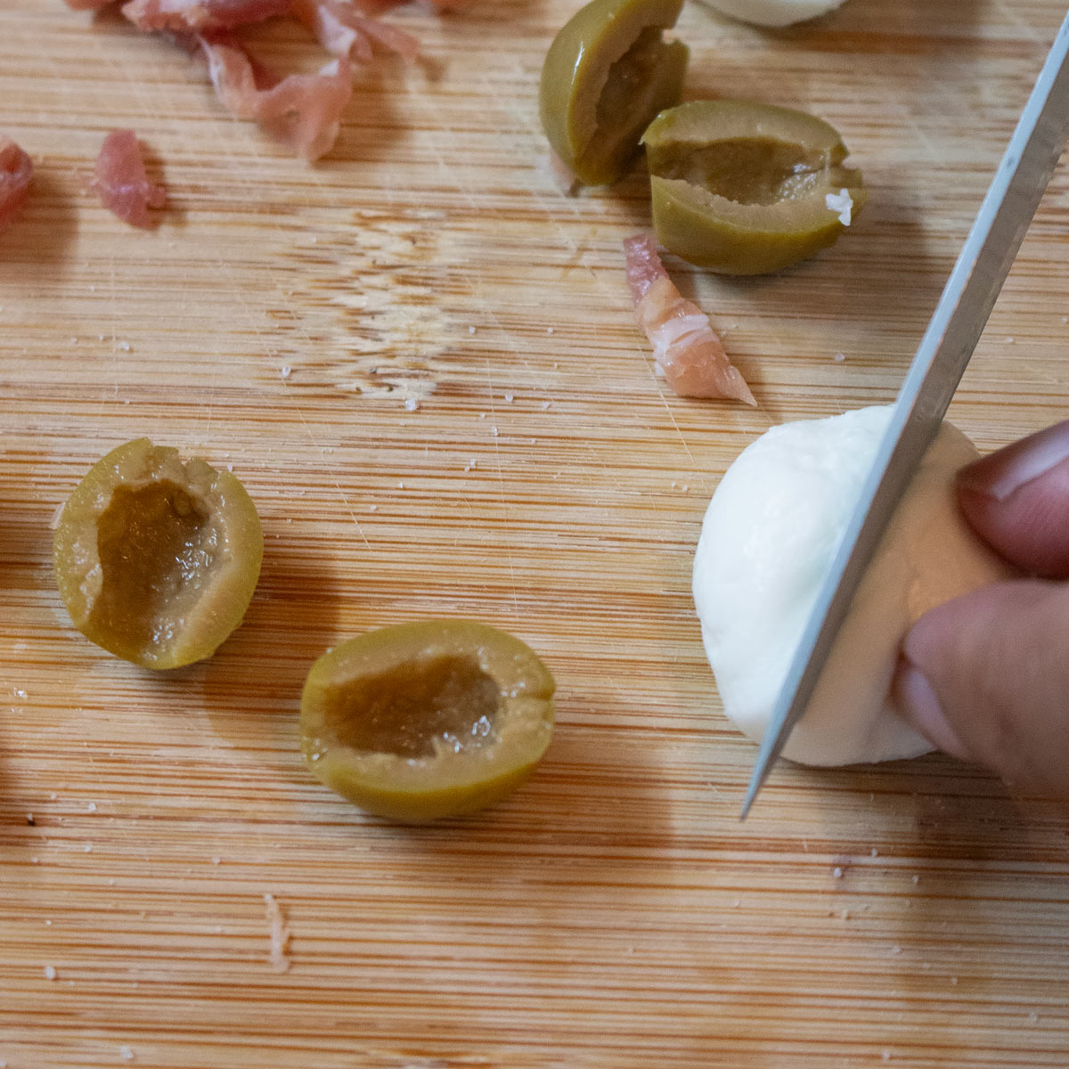 cut mini mozzarella balls into two