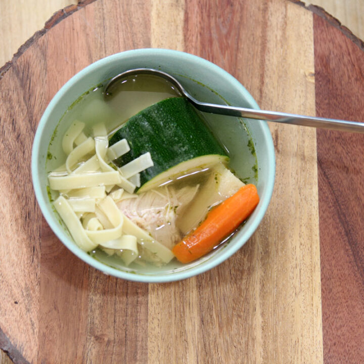 Jewish Chicken Noodle Soup with fresh herbs and noodles