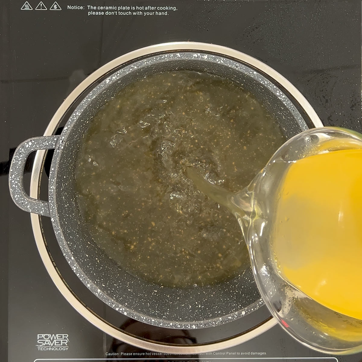 pour broth into a pot