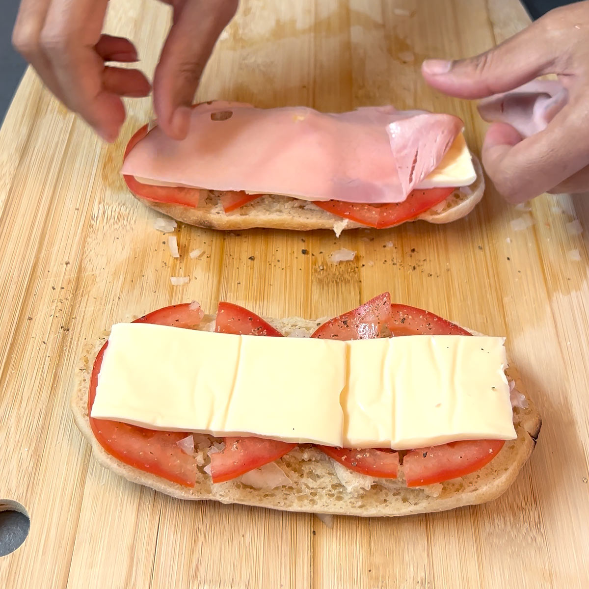 place cheese and ham on panini bread