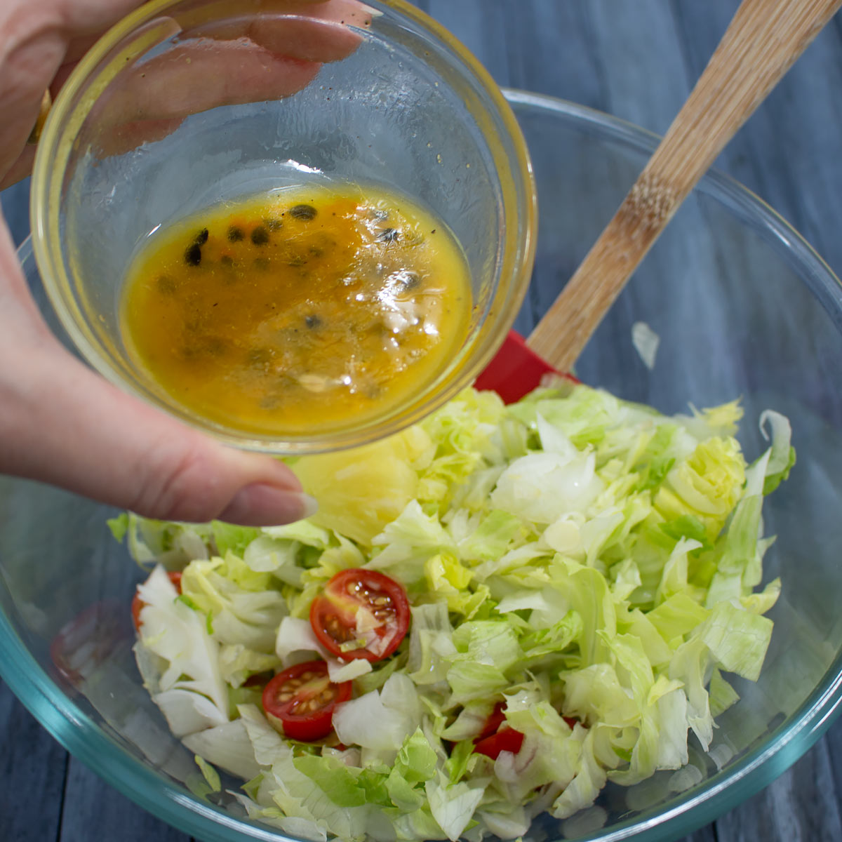 pour dressing over salad