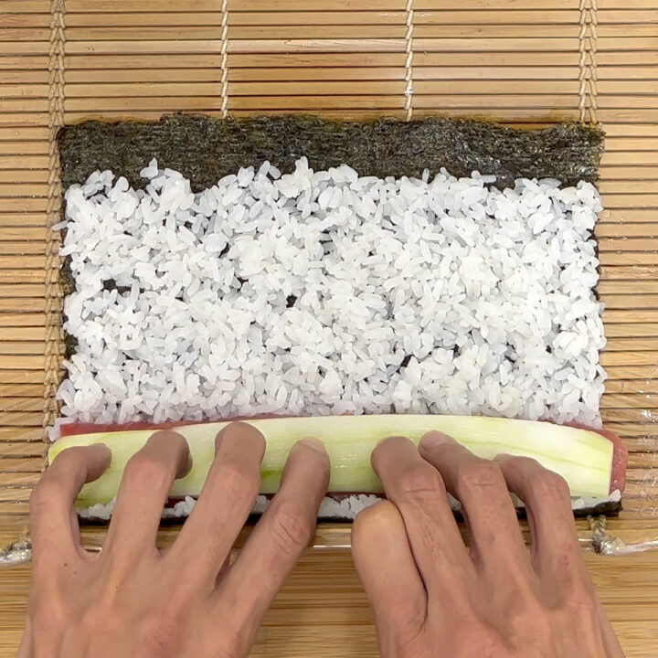Compressing Motion Tuna Cucumber Sushi Roll