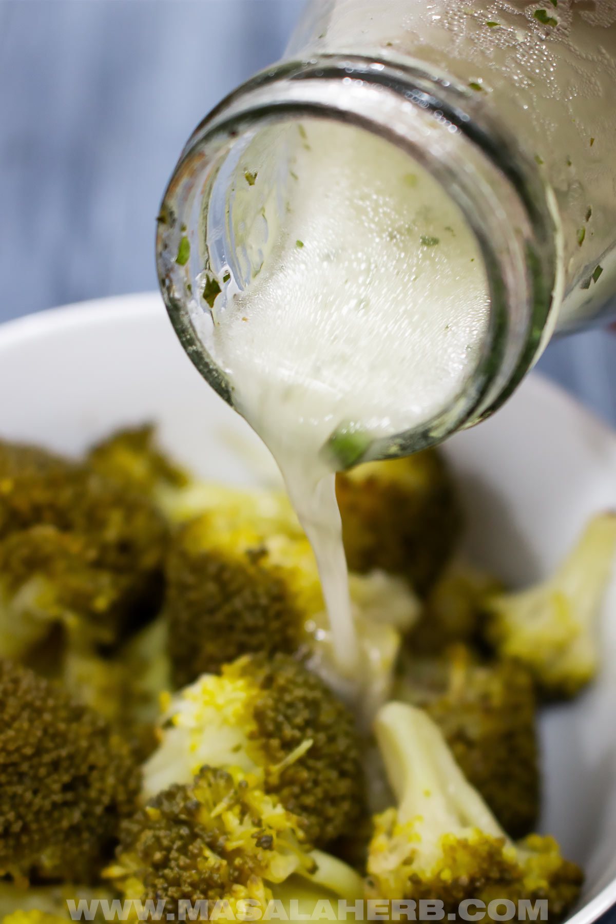 close up pouring Lemon Basil Vinaigrette Dressing