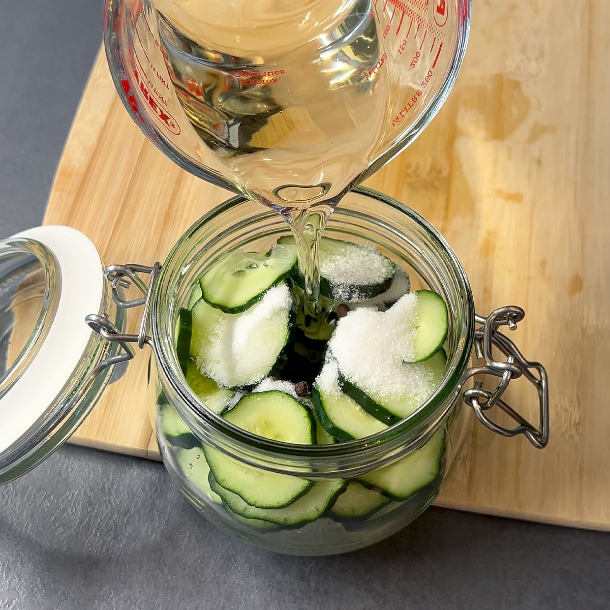 pour vinegar over the cucumber
