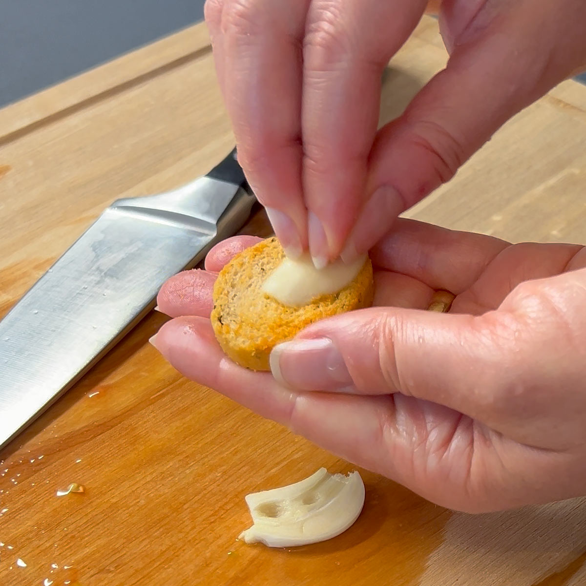 rub garlic against bruschetta