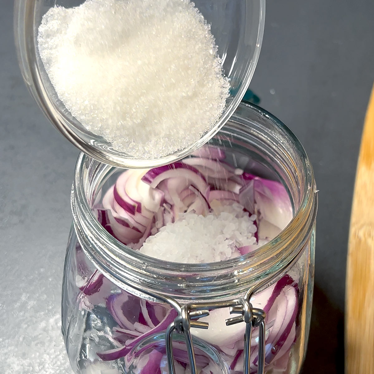 add sugar and salt to the onions