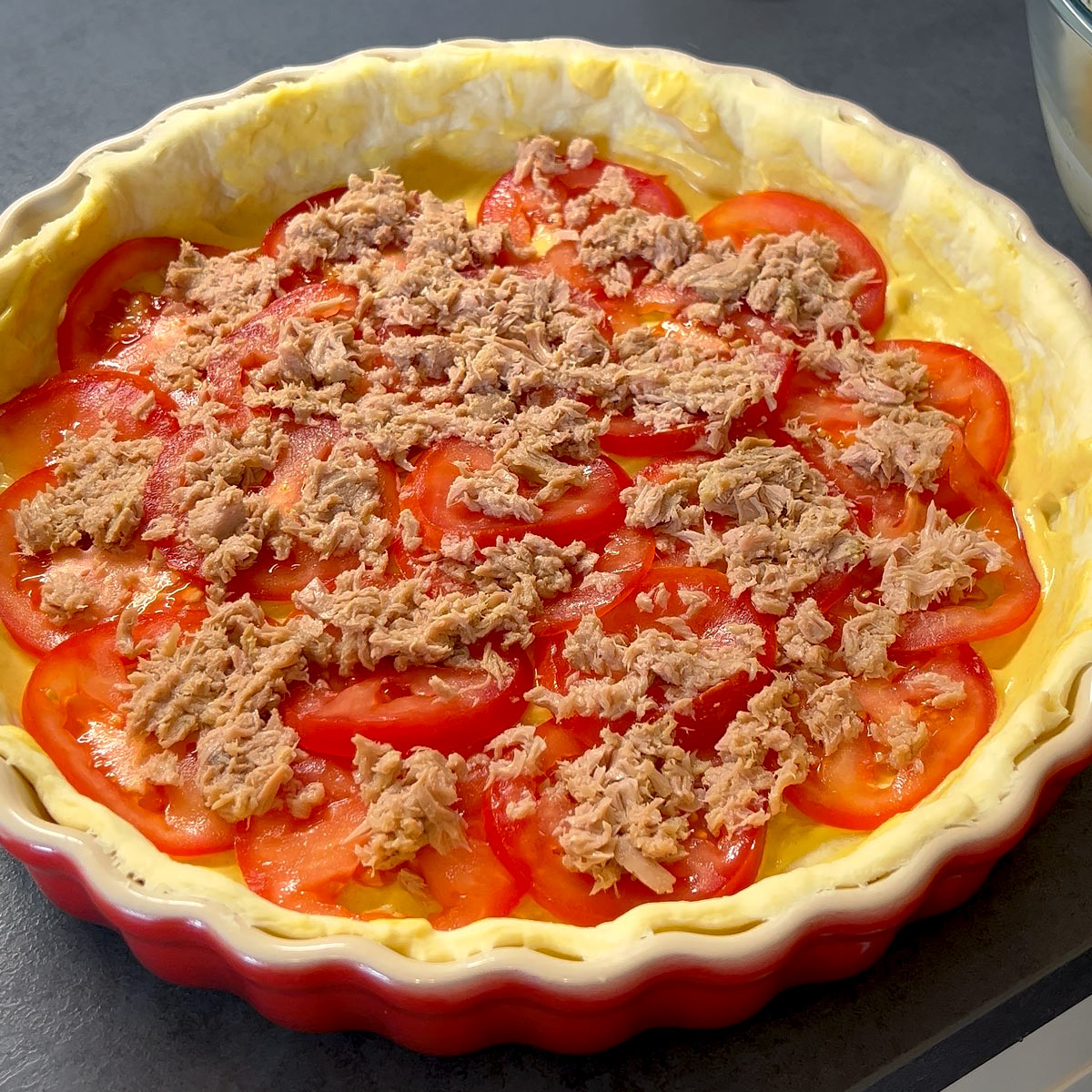 spread tuna over tomato