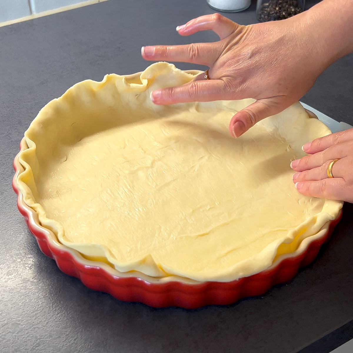 place and arrange rolled out tart dough in the pan