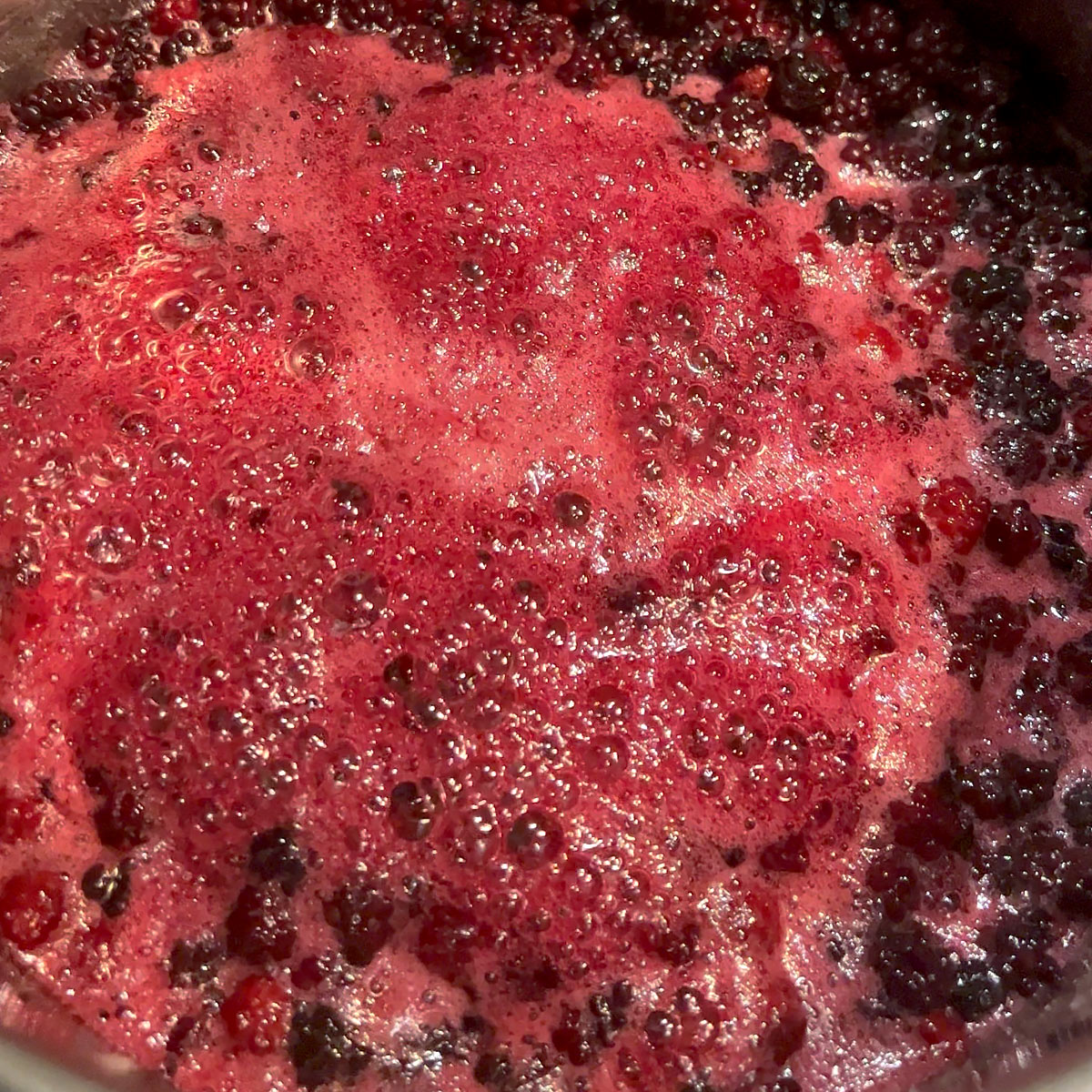 bring blackberries and sugar to a rolling boil