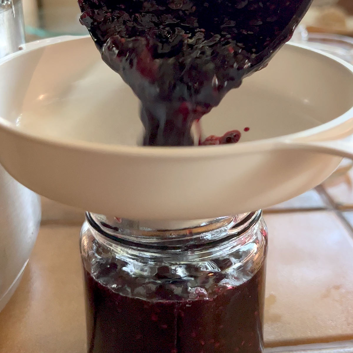 pour jam into jar