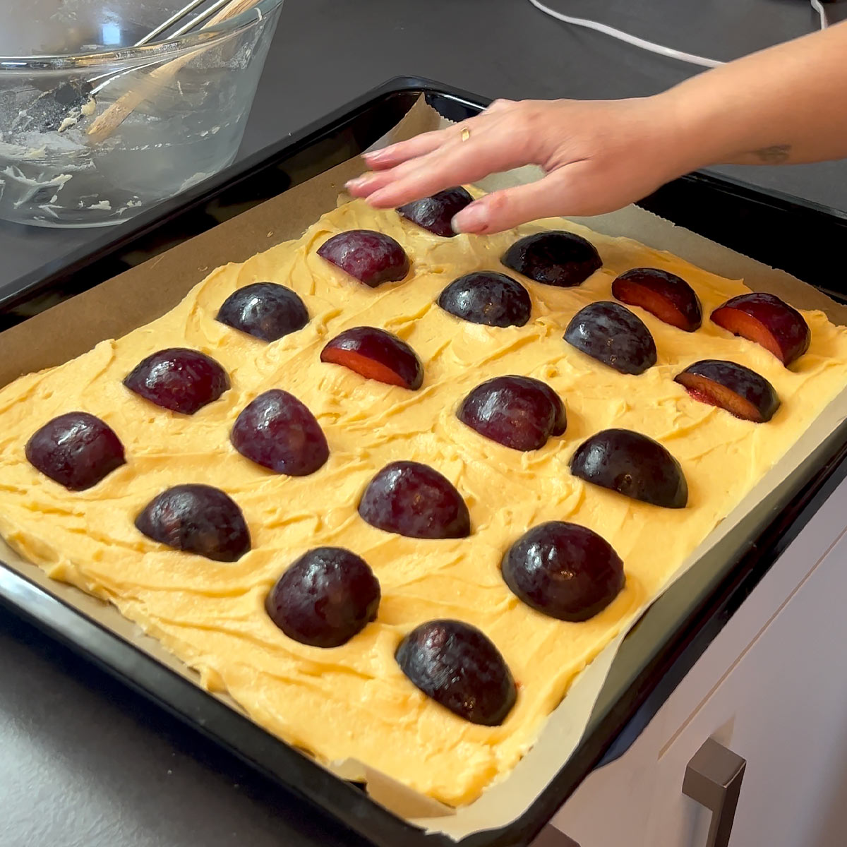 place plums into the cake
