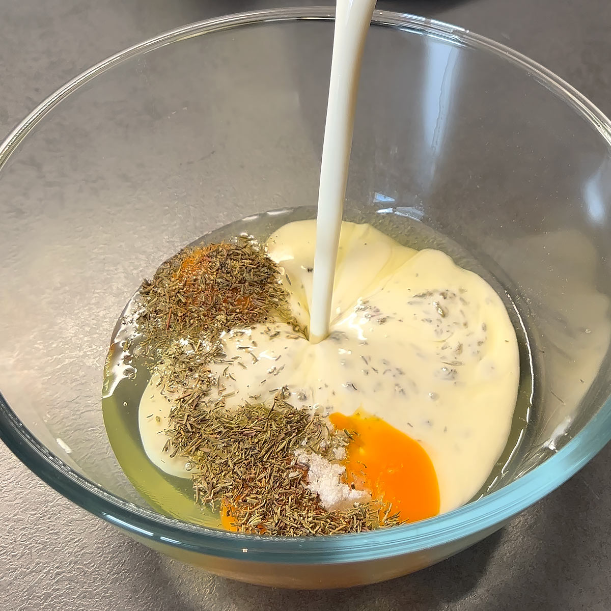 pour cream to the seaosning and eggs