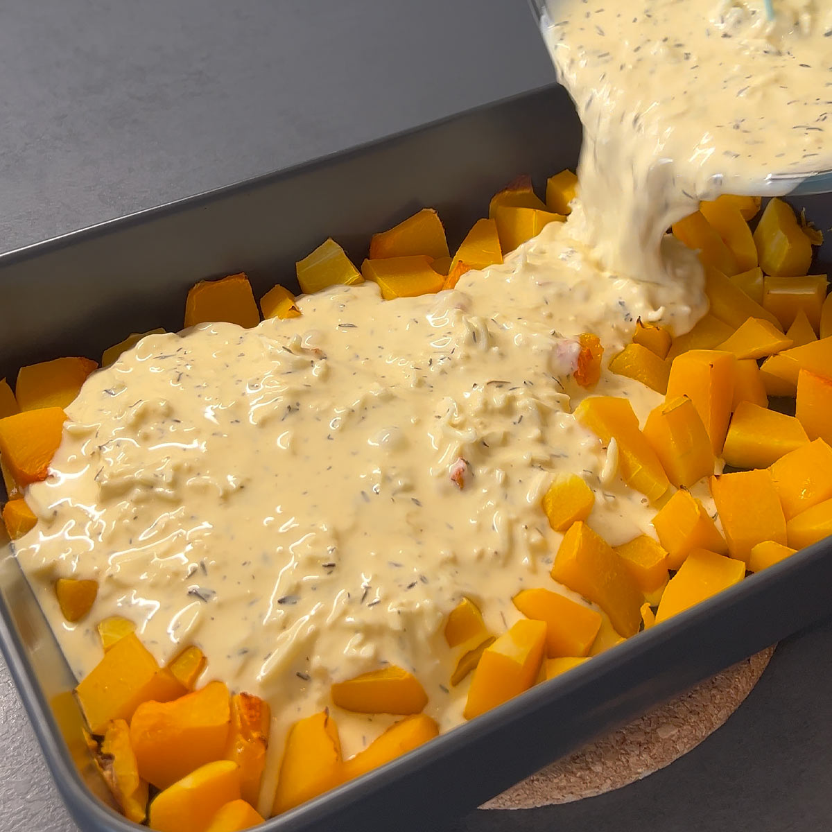 pour the egg and cream mix over the btuternut squash