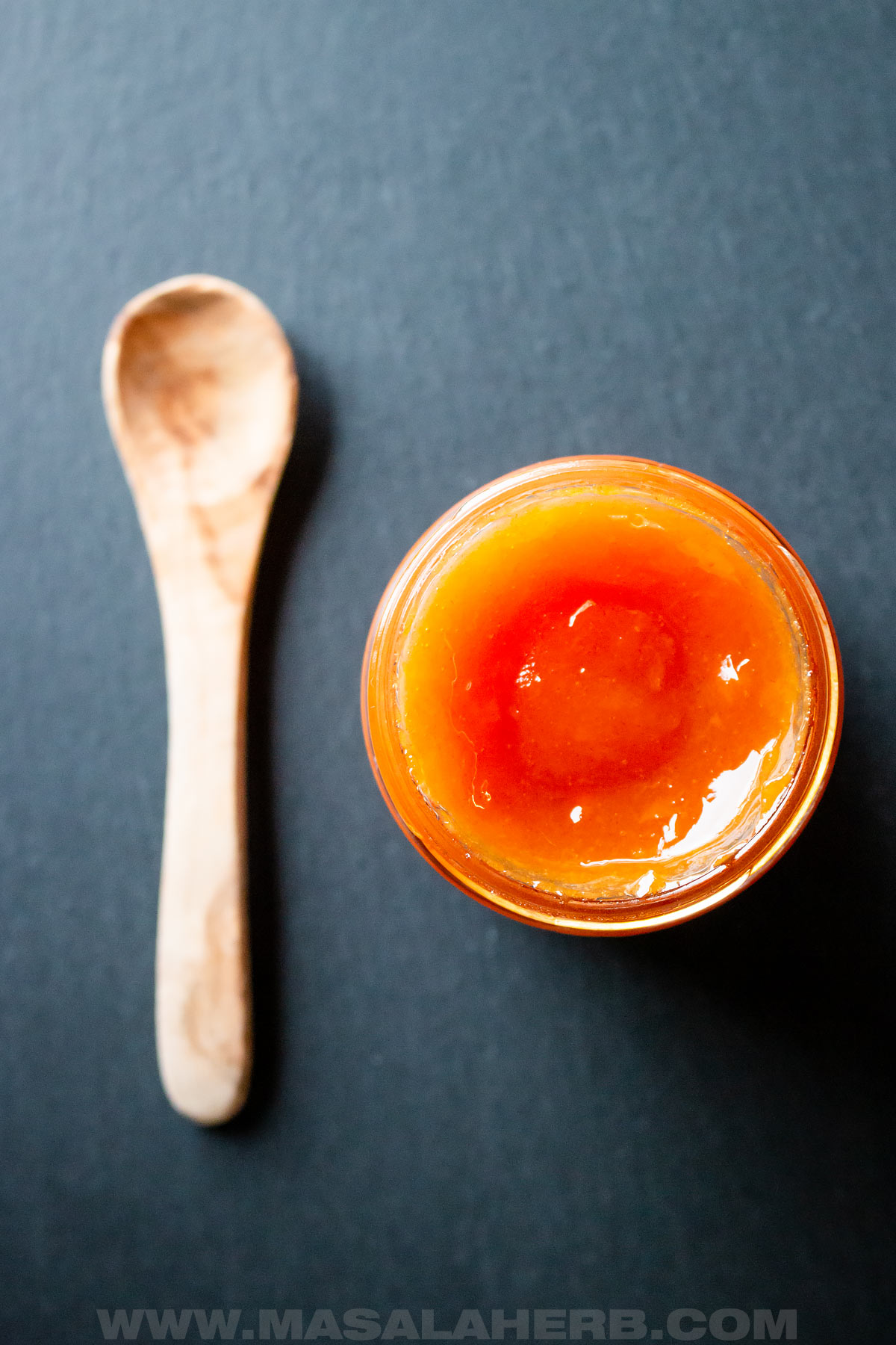 Jam with fresh persimmon fruits