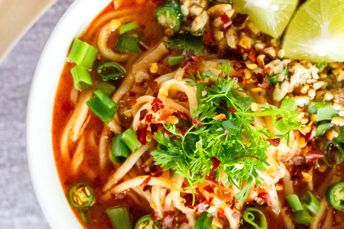 thai noodle soup with fresh vegetables
