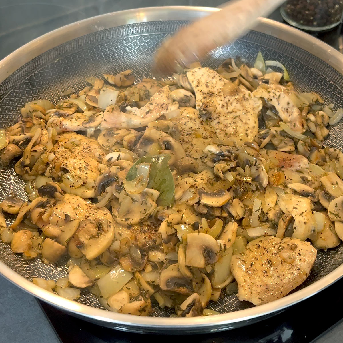 spread mushrooms over chicken