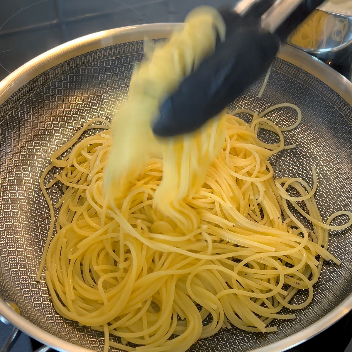 place al dente pasta into a pan