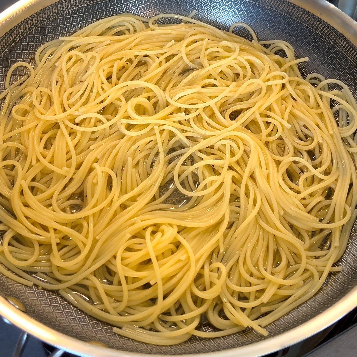 pour pasta water over spaghetti