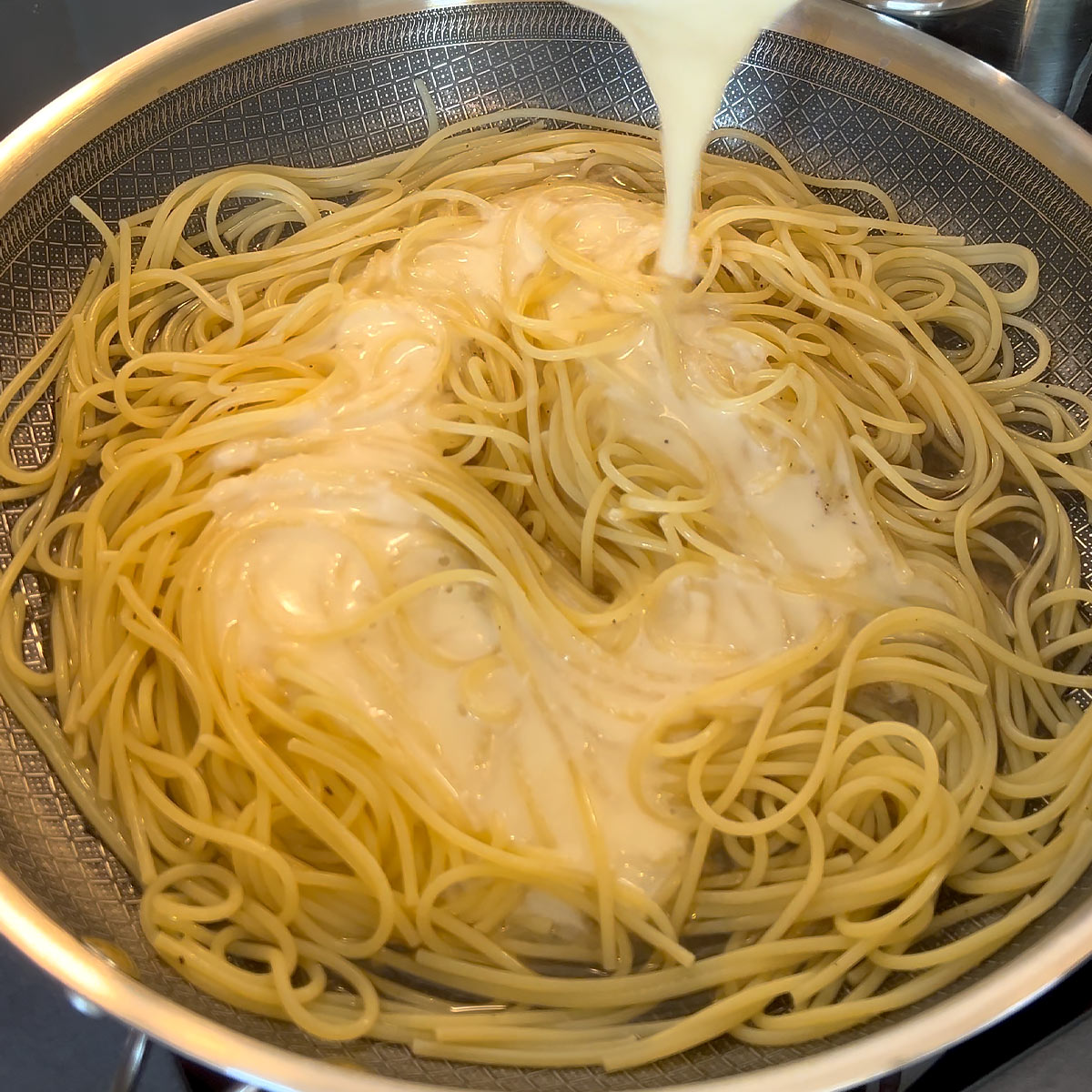 pour cheese sauce over pasta