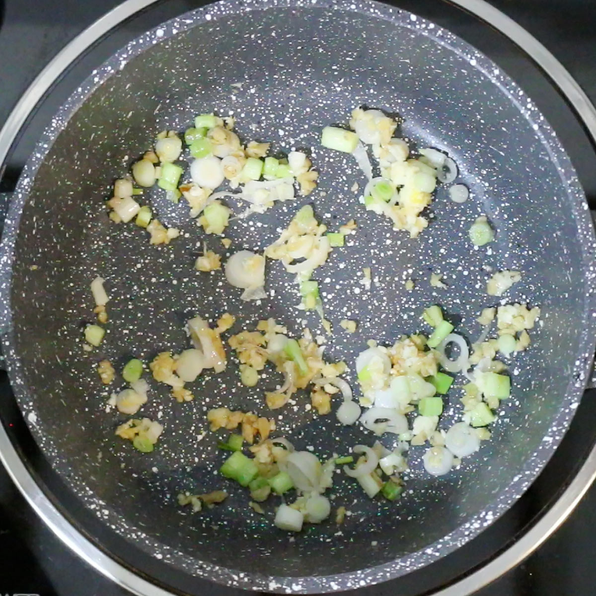 stir cook ginger garlic and green onion bulbs