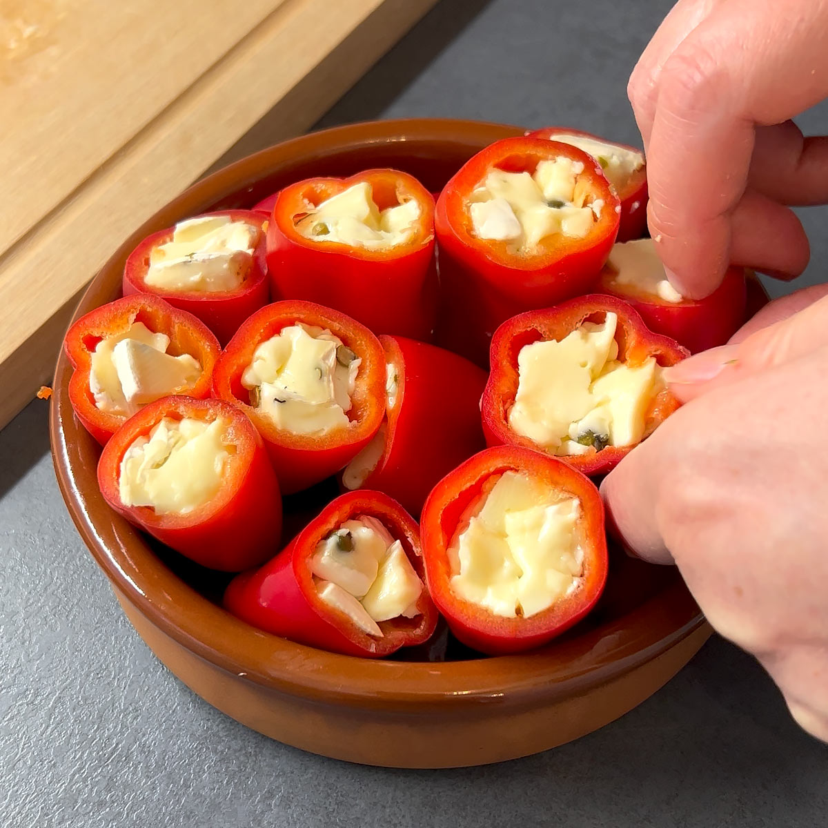arrange stuffed sweet pepper in baking dish