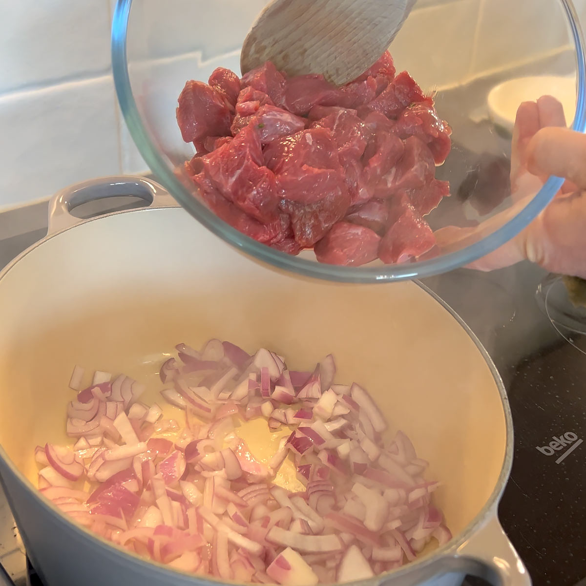 Add steak to the onions