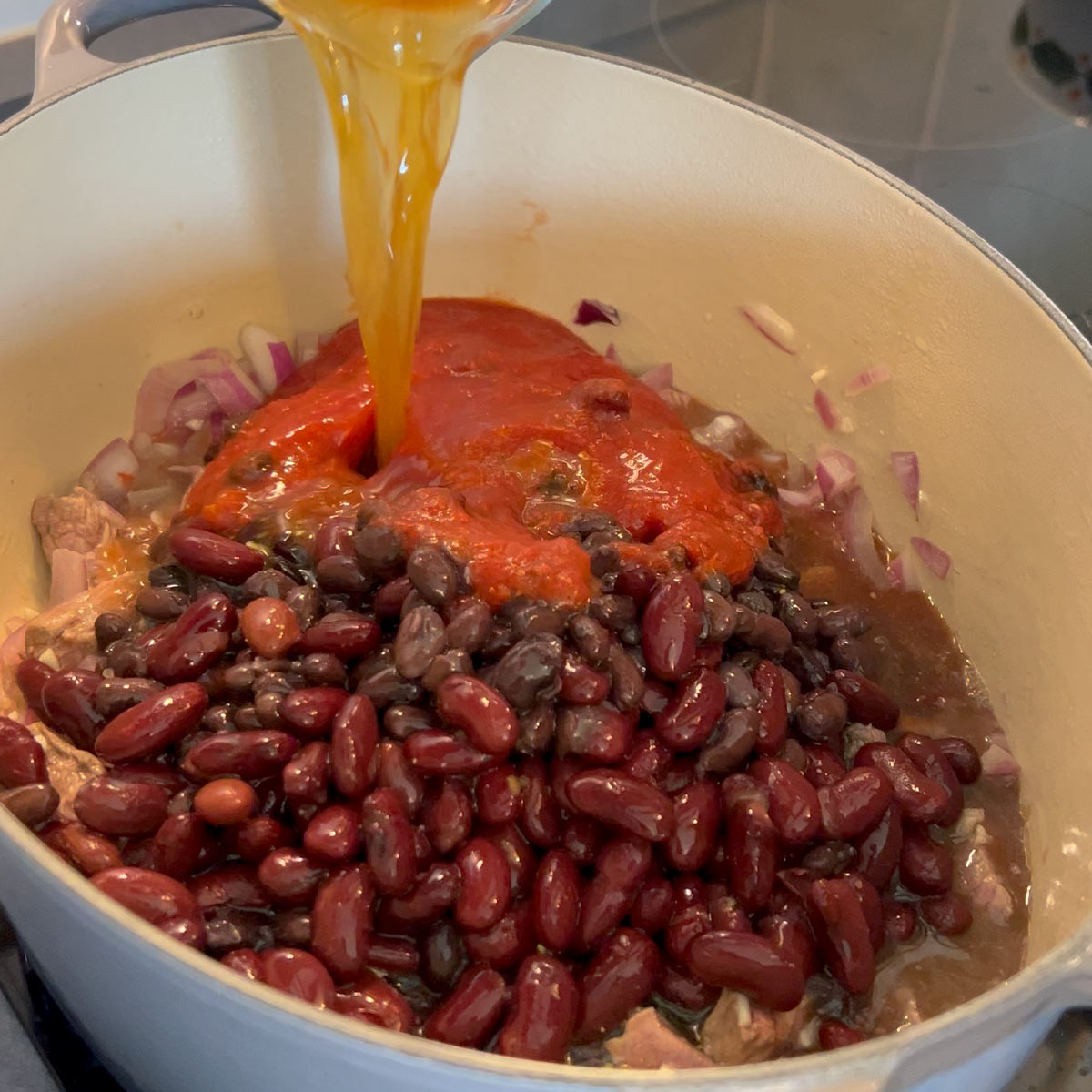 stir in garlic, beans, tomato sauce and broth