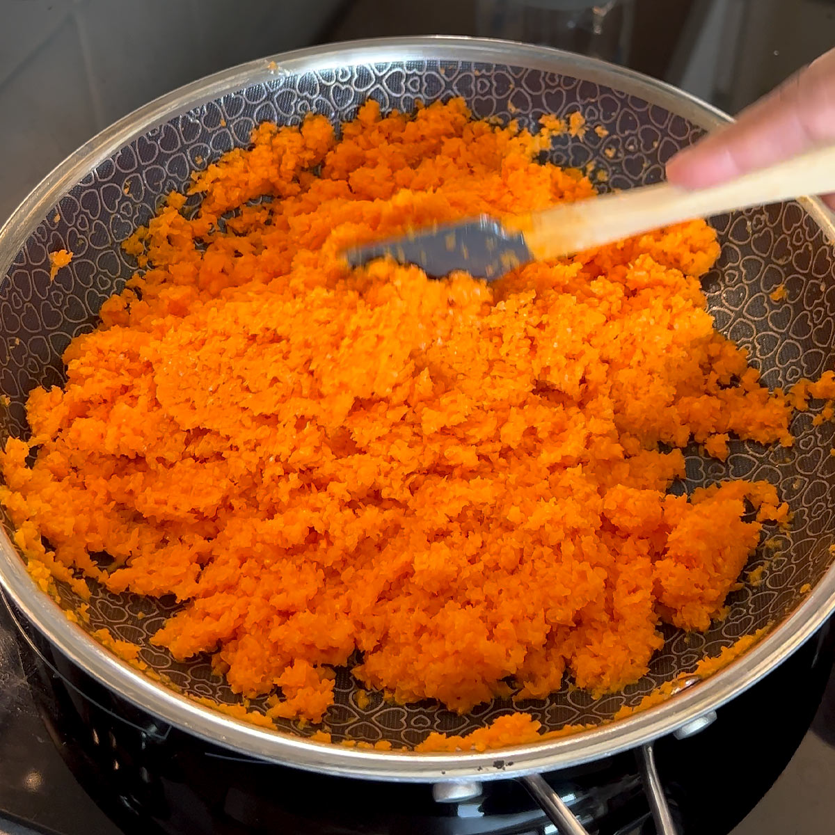 stir cook grated carrot