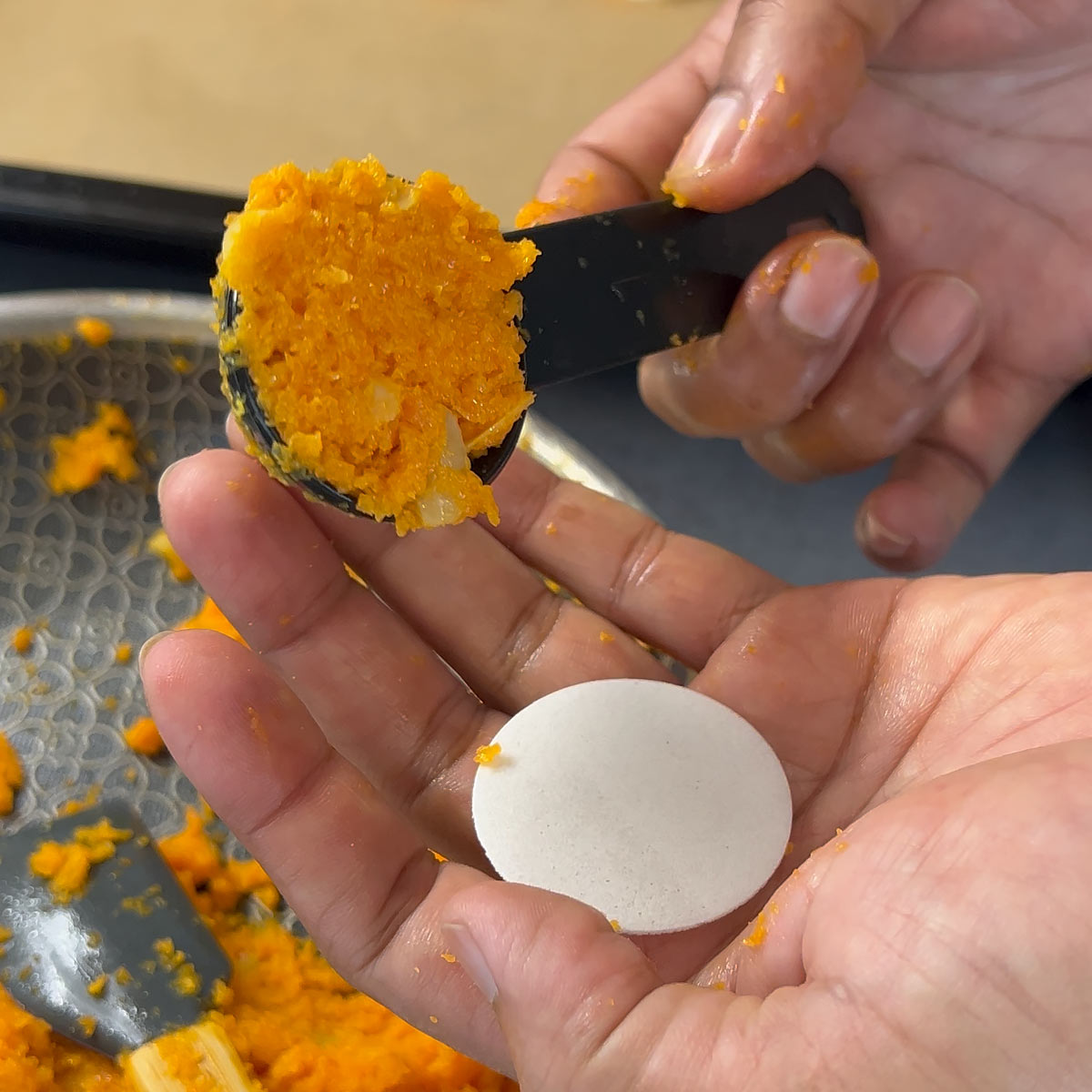 place the carrot cookie mass on a communion wafer