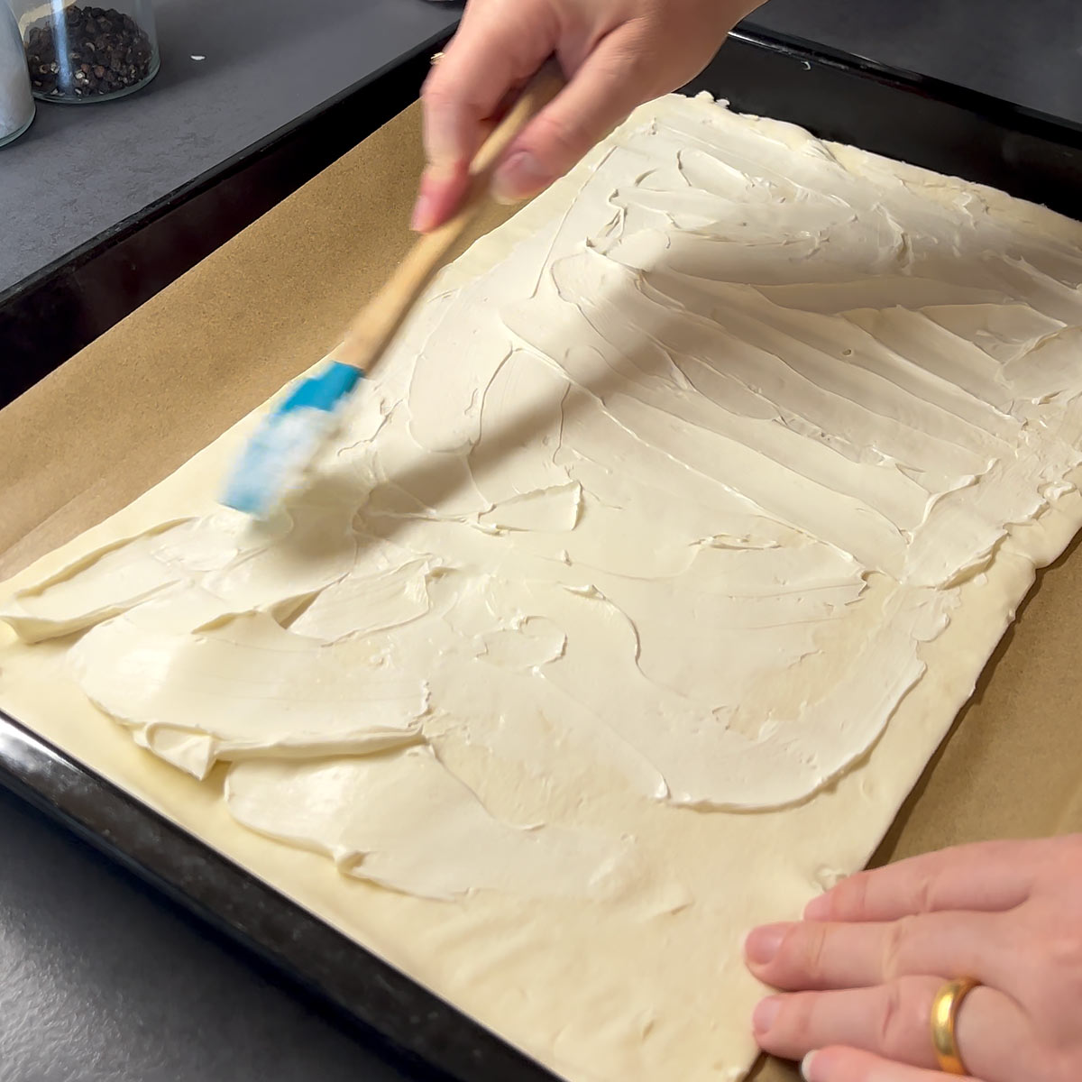 cover puff pastry dough with cream cheese